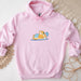 a pink hoodie with a picture of a dog on it
