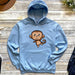 a blue hoodie with a cartoon monkey on it
