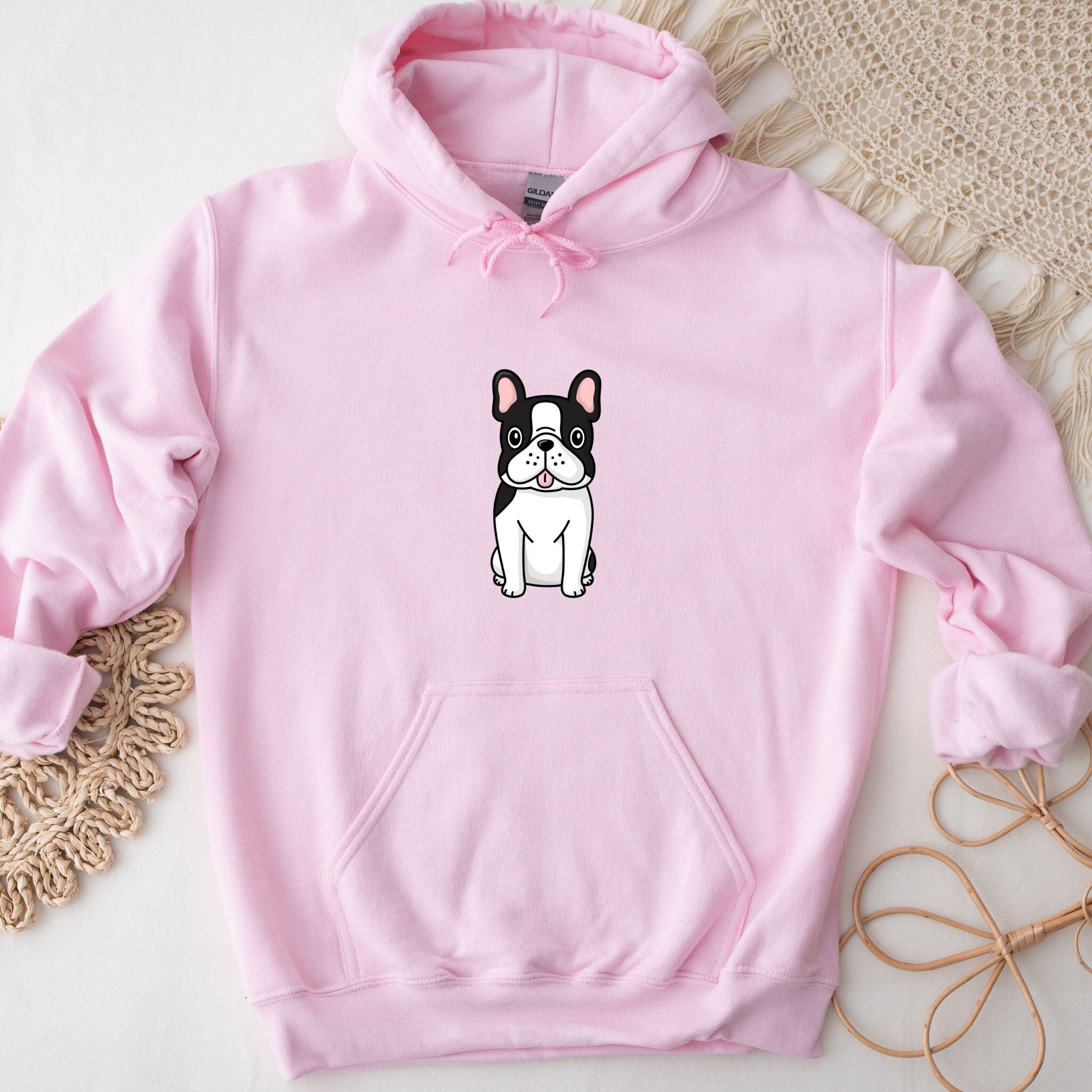 a pink hoodie with a black and white dog on it