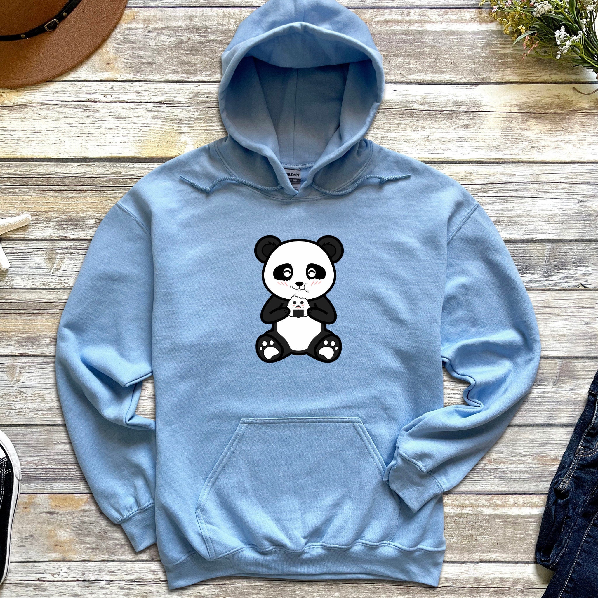 a blue hoodie with a panda bear on it