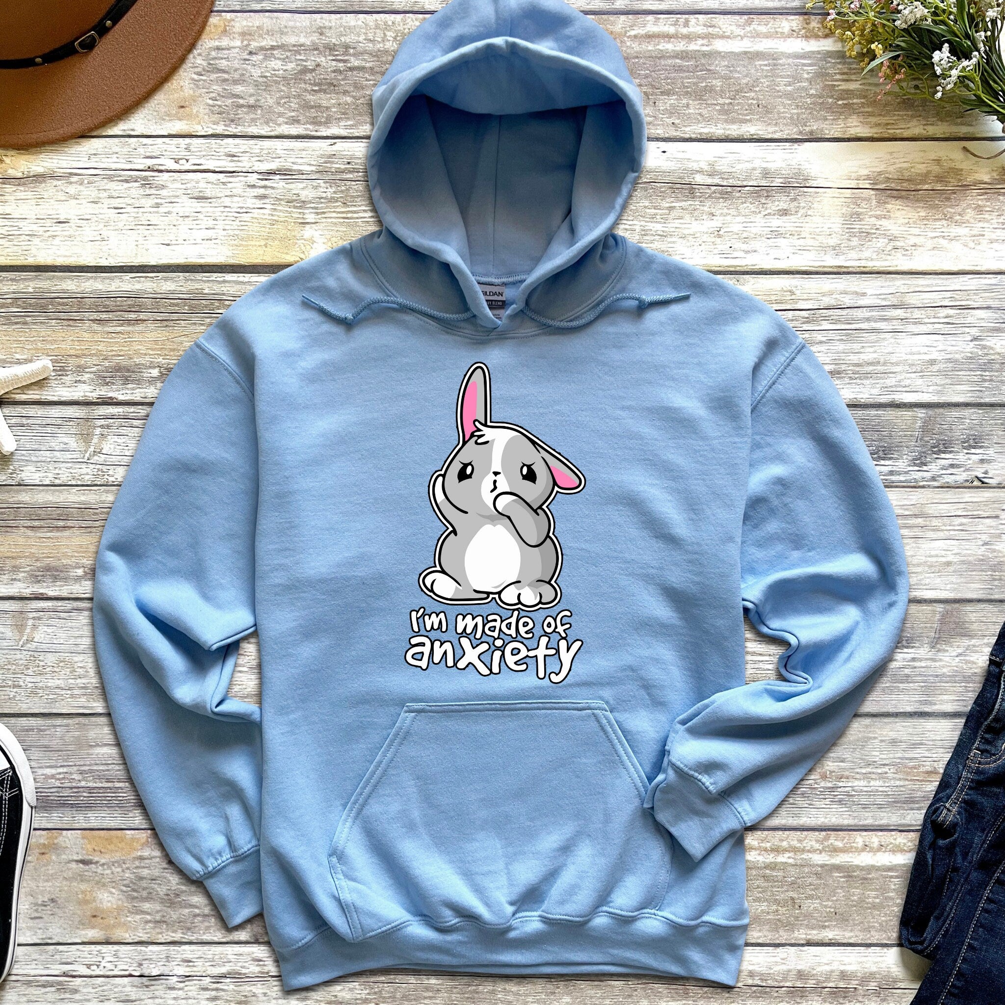 a blue hoodie with an image of an elephant on it