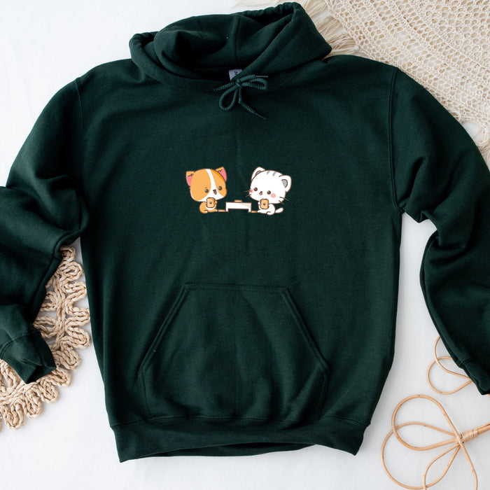a green hoodie with a picture of a dog and a cat on it