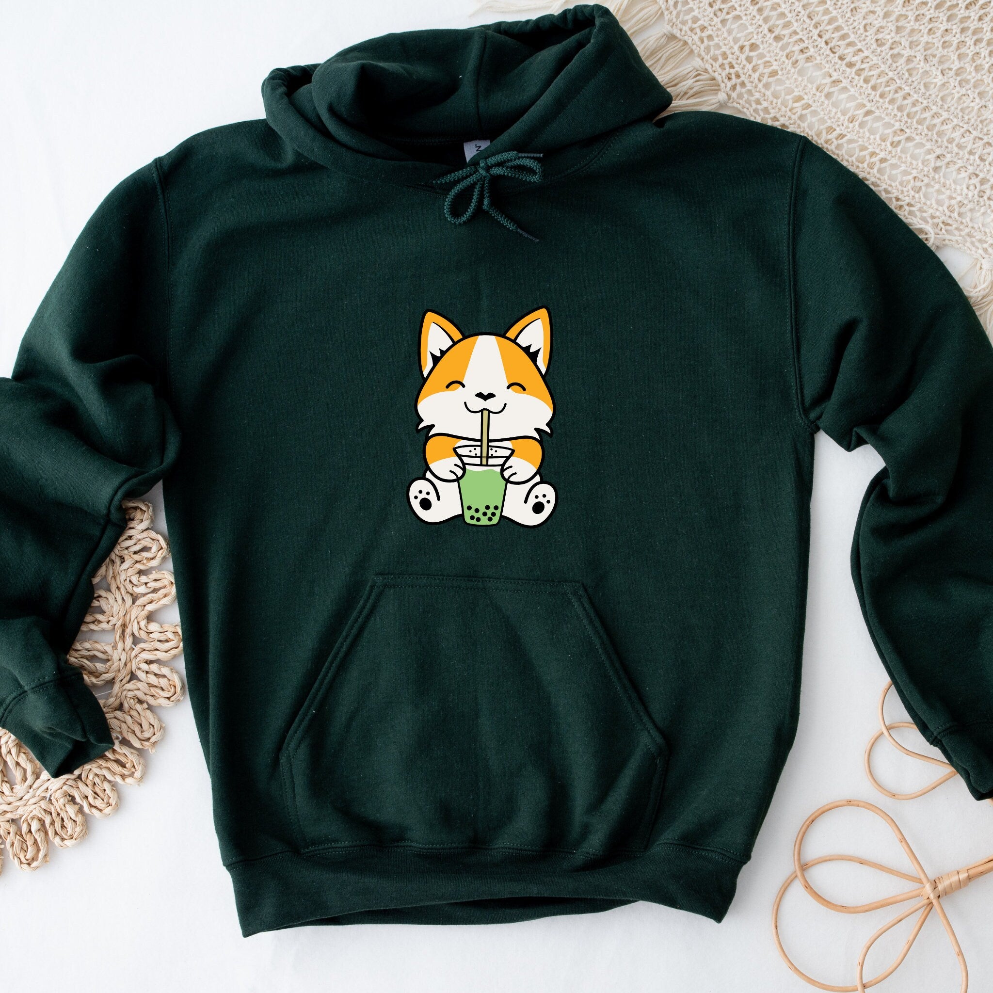 a green hoodie with a picture of a cat on it