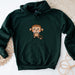 a green hoodie with a cartoon monkey on it