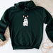 a green hoodie with a picture of a dog on it