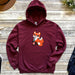 a red hoodie with a cartoon fox on it