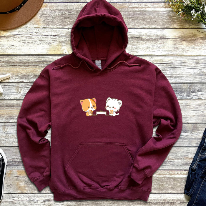 a maroon hoodie with two cats and a dog on it