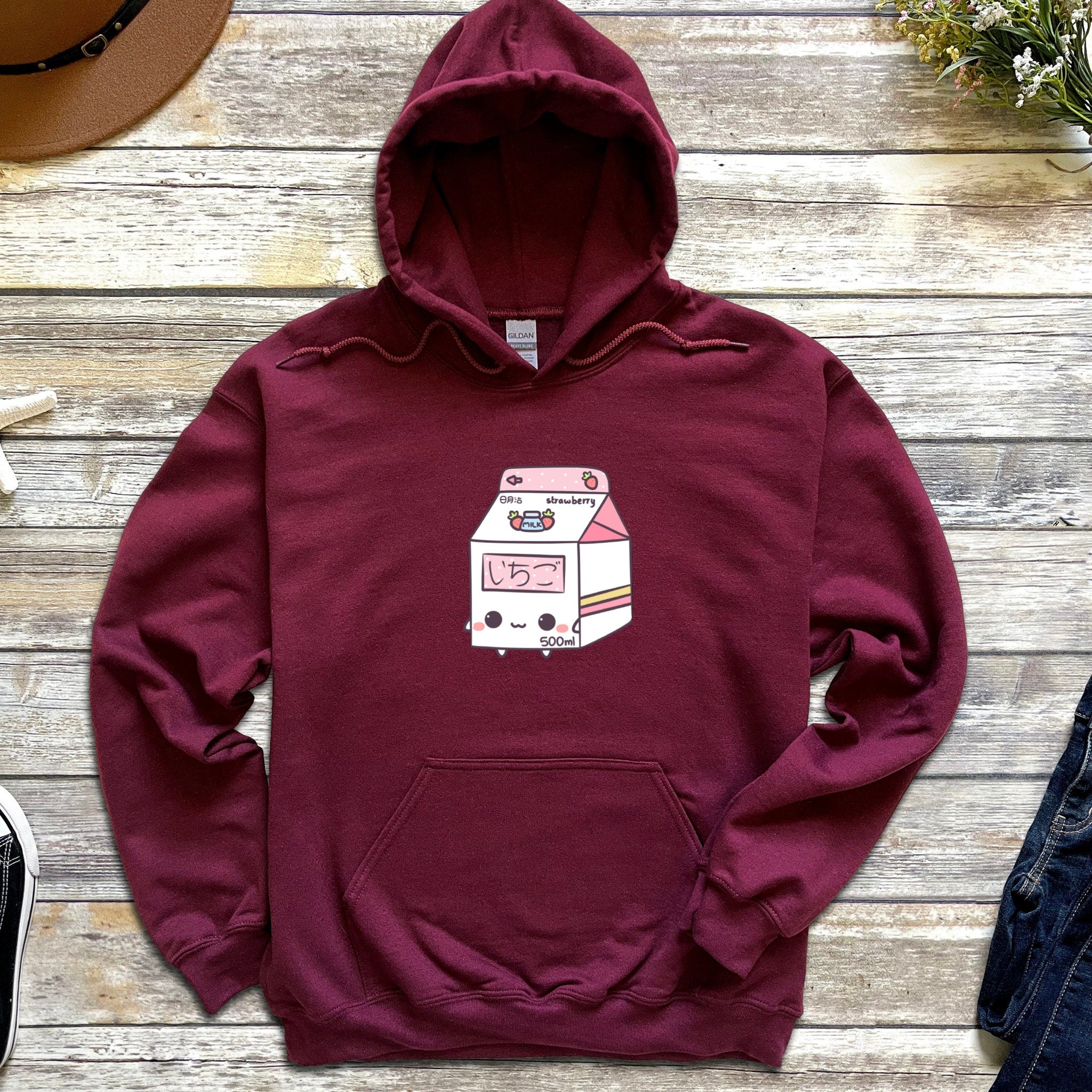 a maroon hoodie with an image of a food truck on it