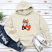 a white hoodie with a red fox on it