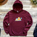 a maroon hoodie with a picture of a dog on it