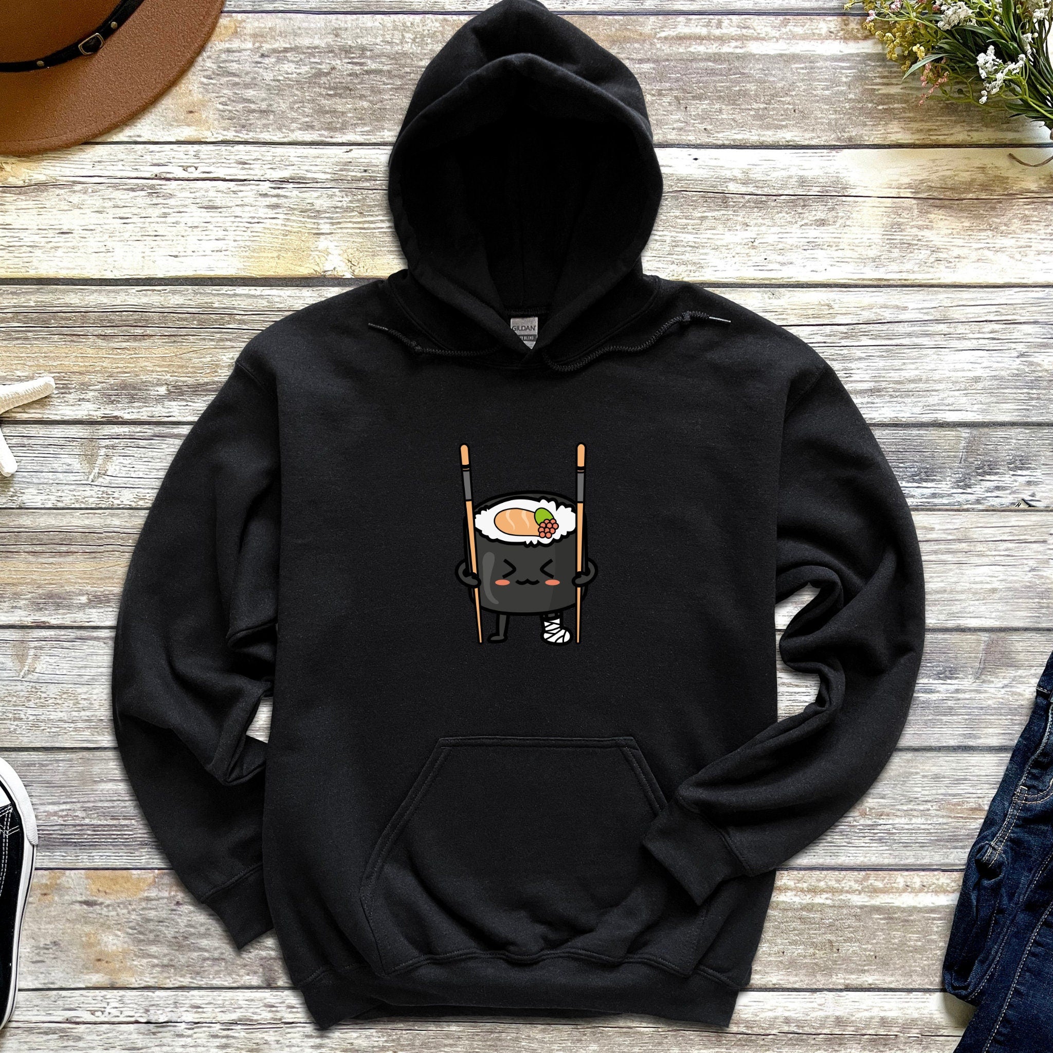 a black hoodie with a sushi on it