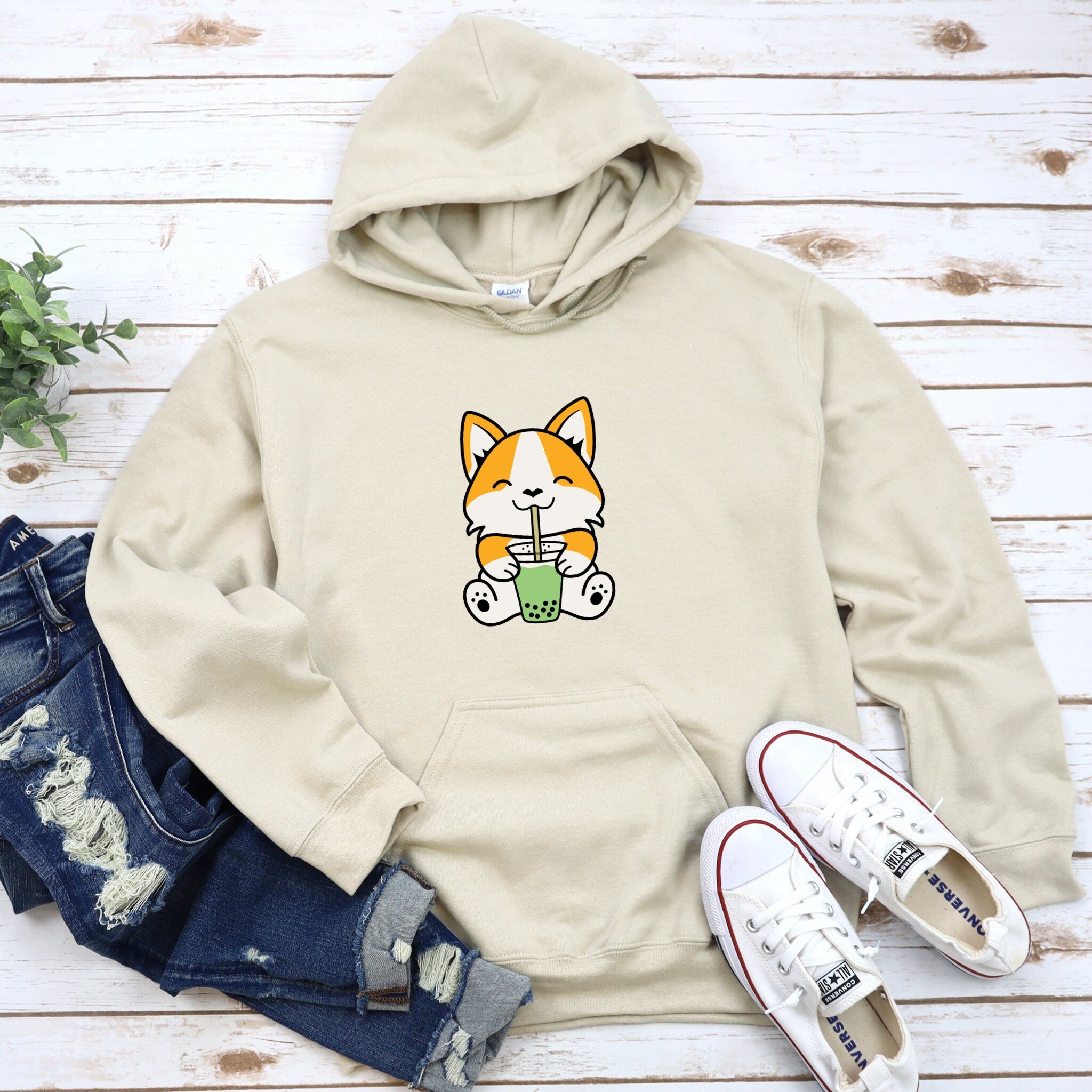 a cat with a cup of coffee on a hoodie