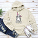 a white hoodie with a cartoon bunny on it