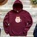 a maroon sweatshirt with a coffee cup on it