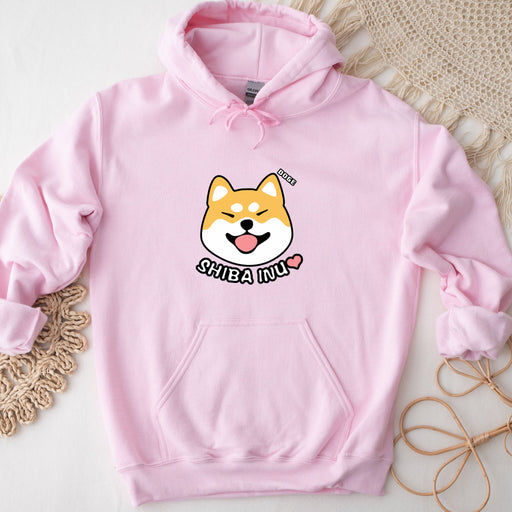 a pink hoodie with a cartoon dog on it