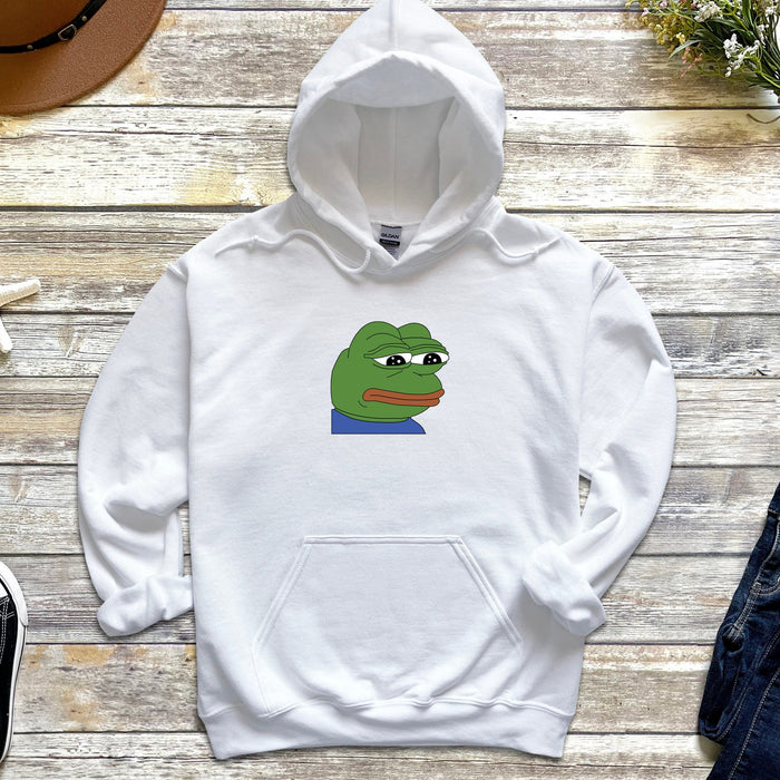 a white hoodie with a cartoon of a frog on it
