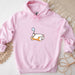 a pink hoodie with a cartoon cat on it