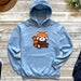 a blue hoodie with a red panda bear on it