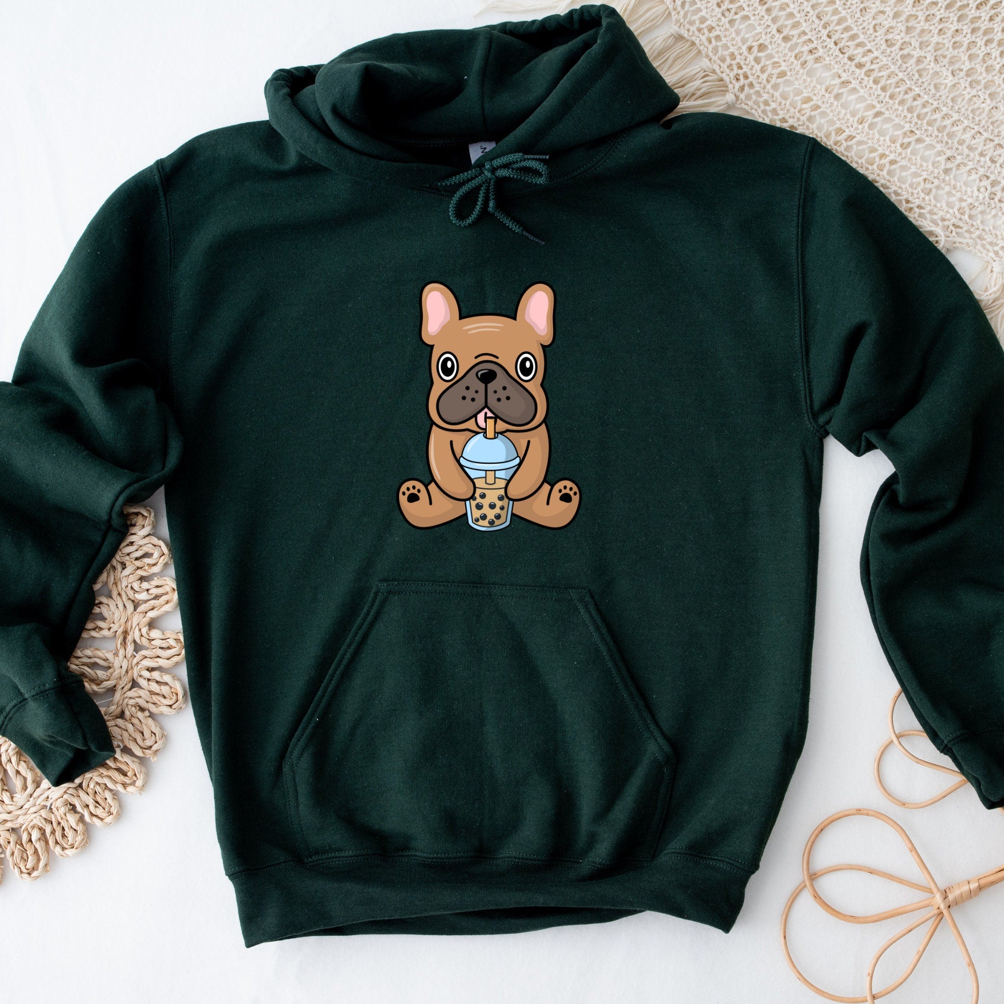 a green hoodie with a picture of a dog on it