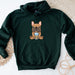 a green hoodie with a picture of a dog on it