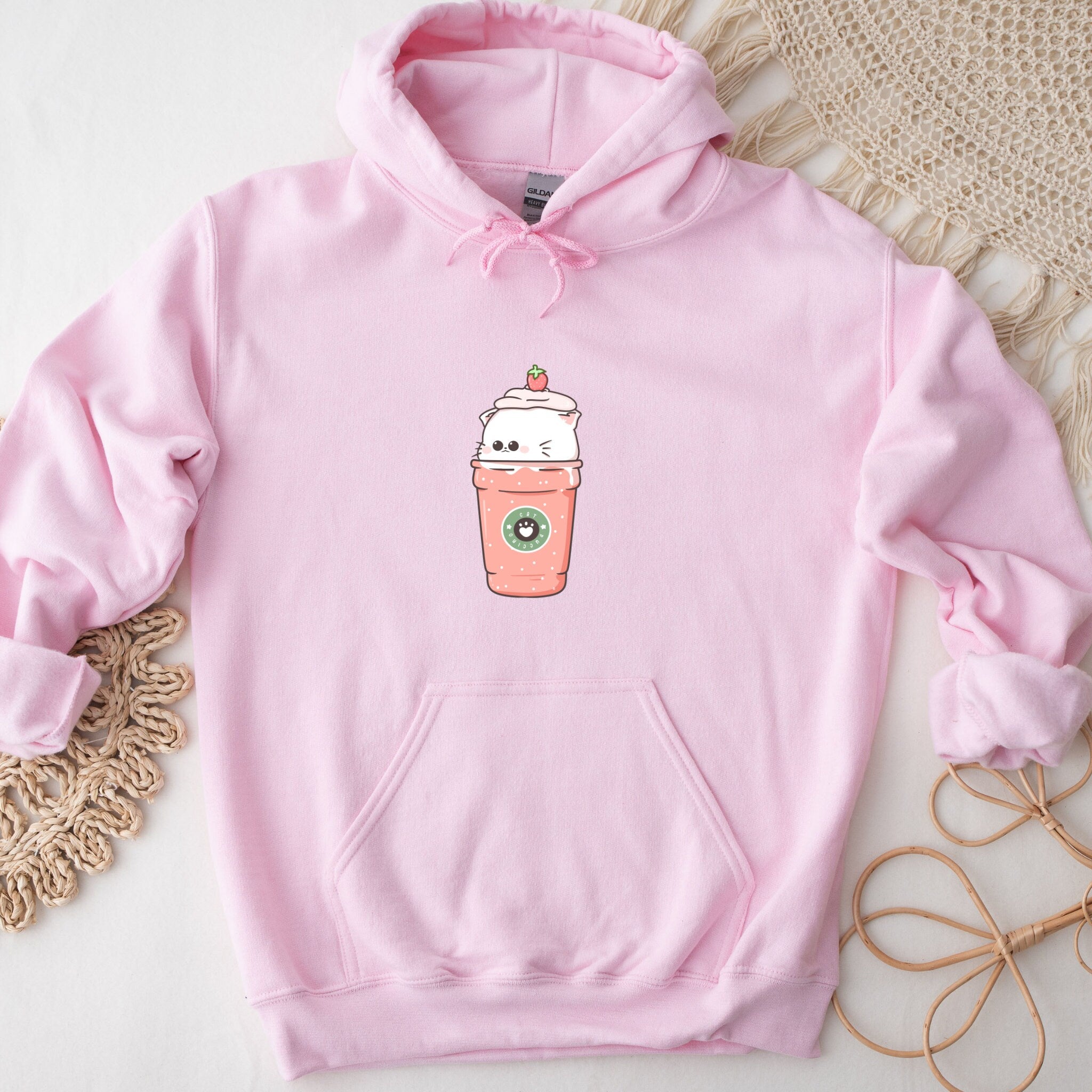 a pink hoodie with a cup of coffee on it