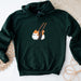 a green hoodie with a picture of a cat holding chopsticks