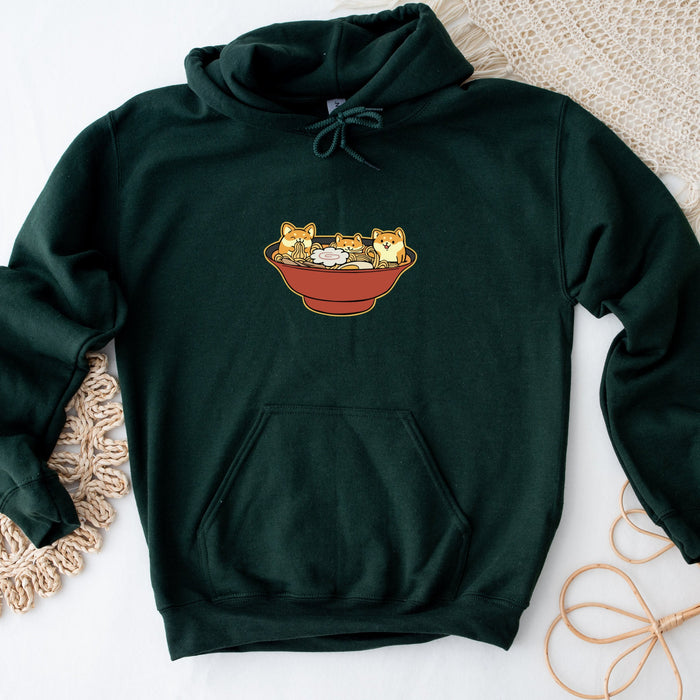 a green sweatshirt with a picture of three cats in a bowl