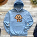 a blue hoodie with a cartoon monkey on it