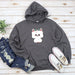 a gray sweatshirt with a white dog on it