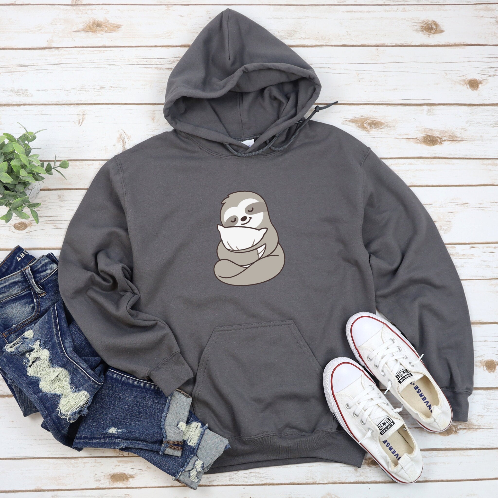 a grey sweatshirt with a sloth on it