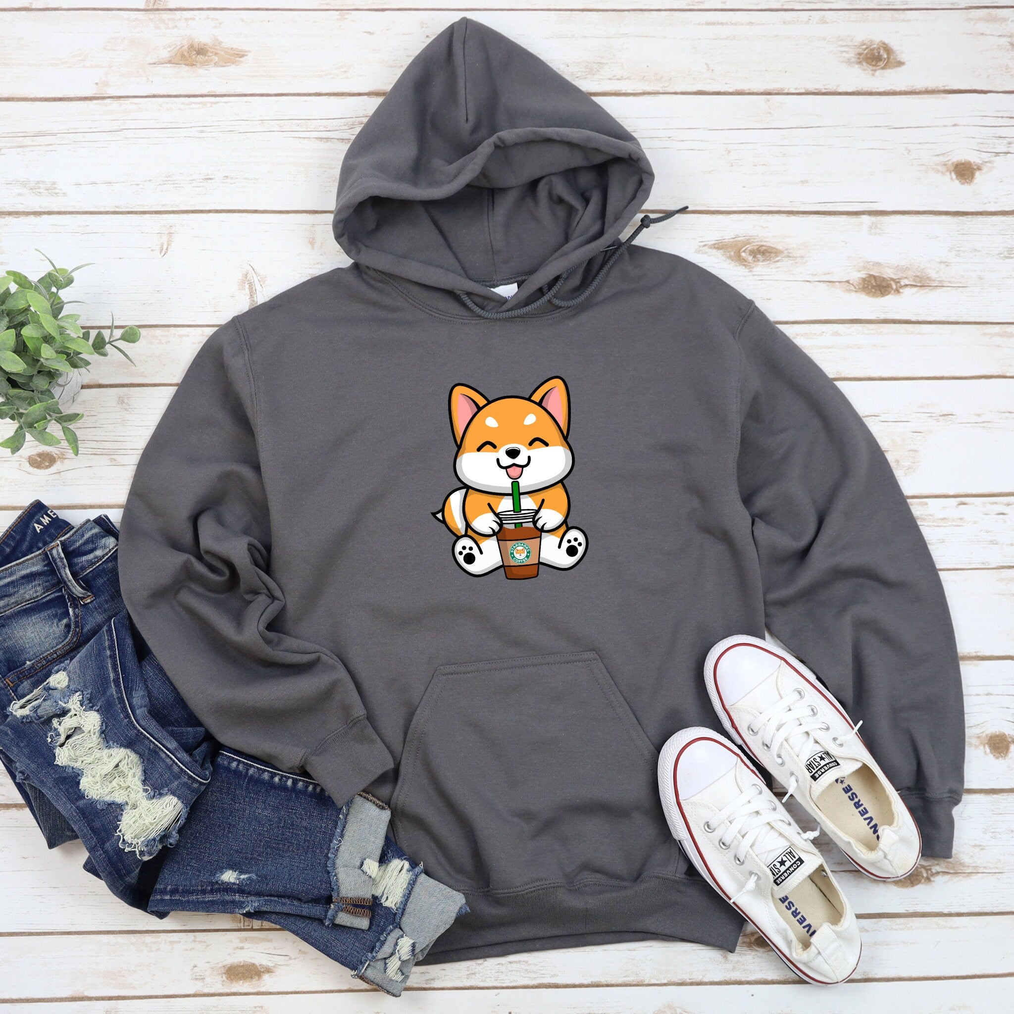 a gray hoodie with a cartoon cat on it