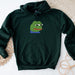 a green hoodie with a picture of a frog on it