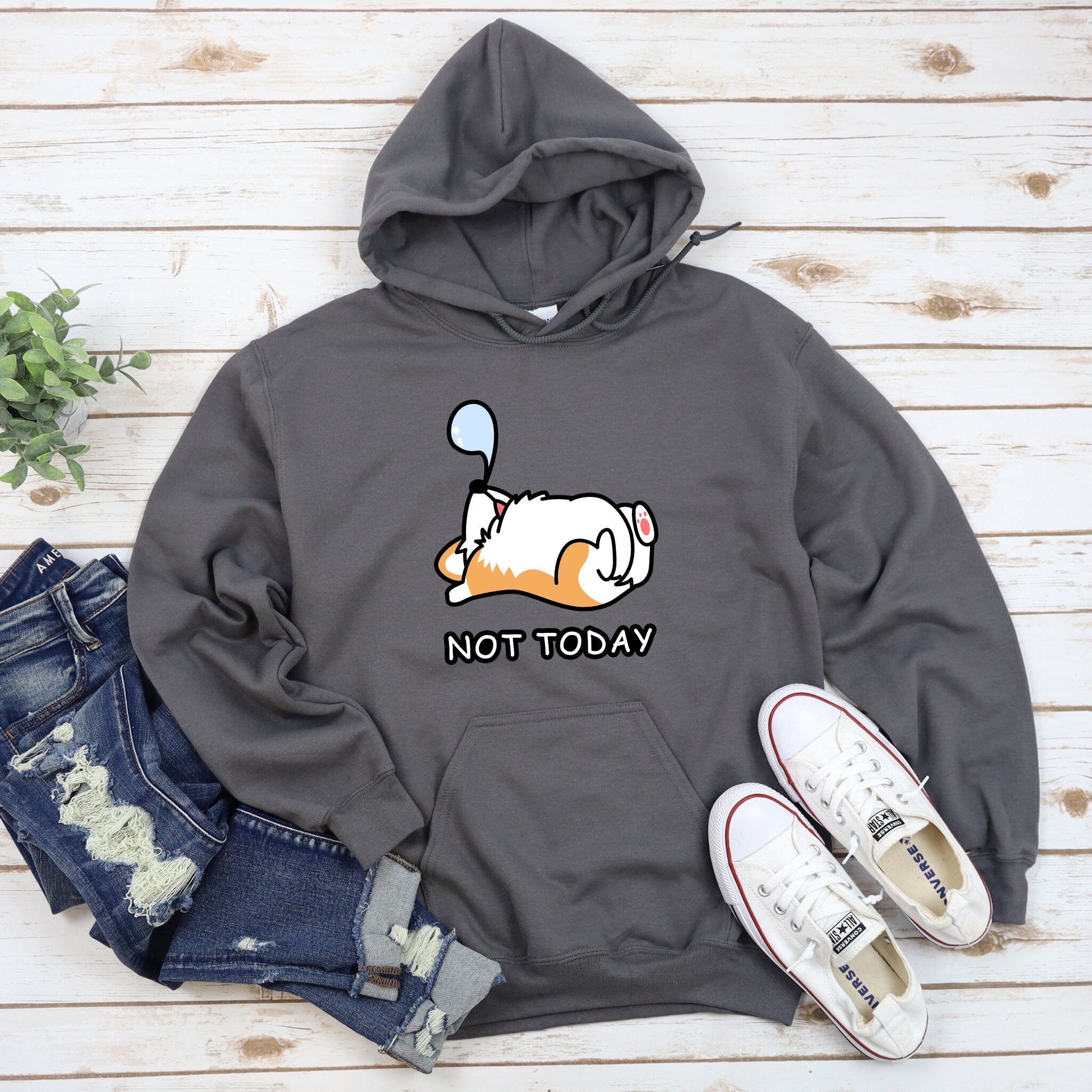 a gray hoodie with a cartoon dog on it