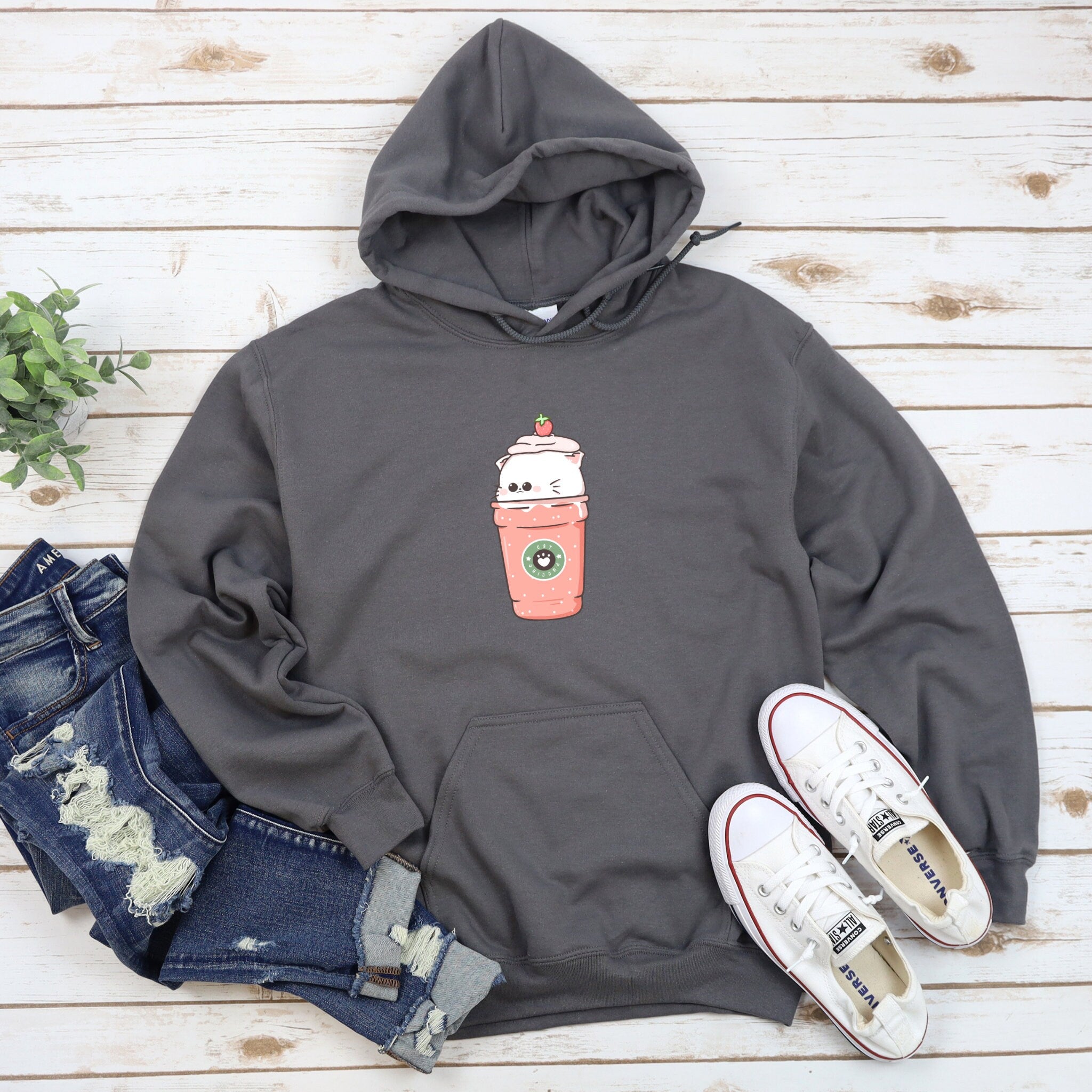 a gray hoodie with a coffee cup on it