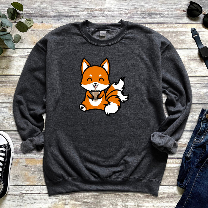 a sweatshirt with a fox on it next to a pair of jeans