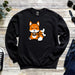 a black sweater with an orange fox on it